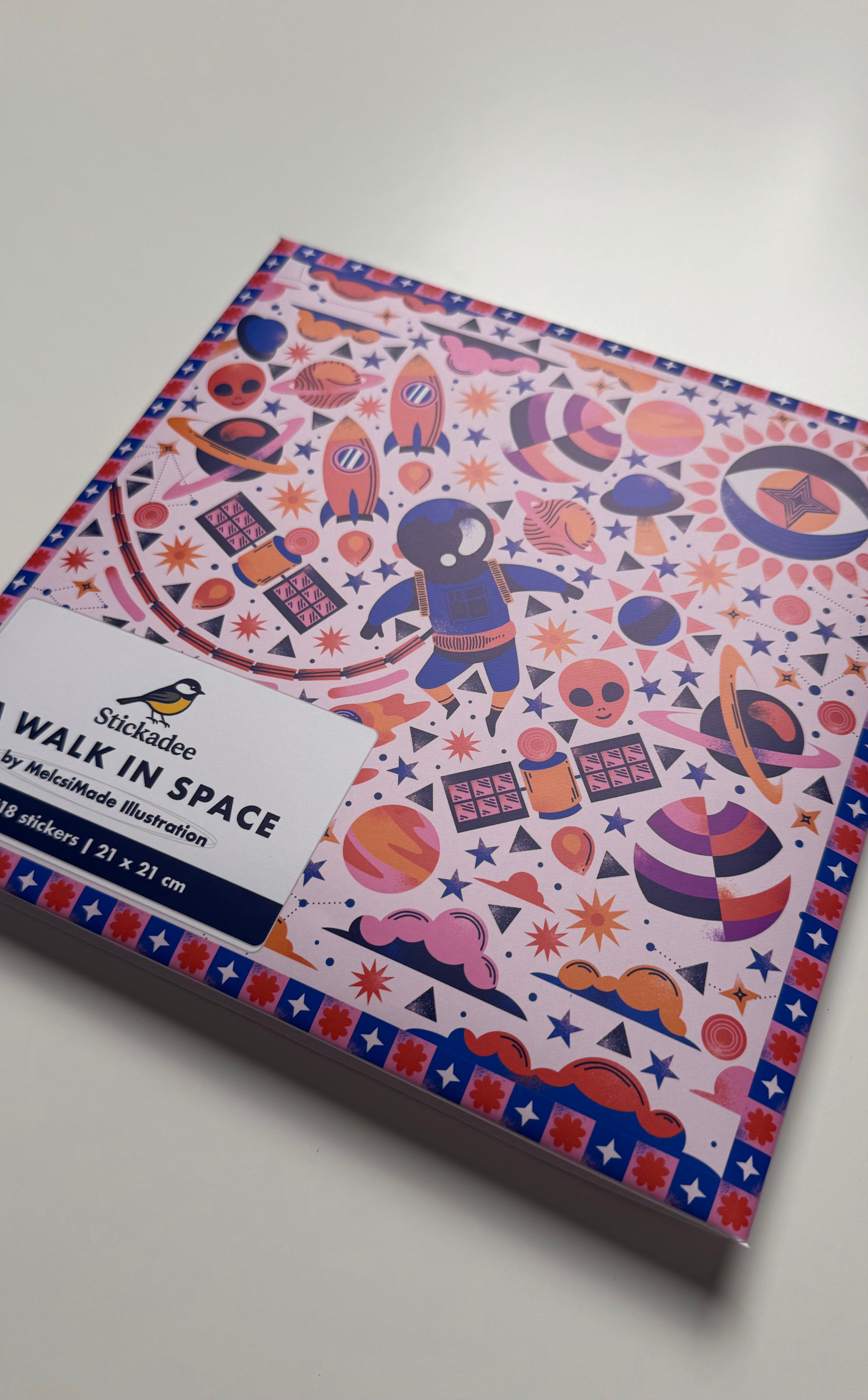 Sticker book titled 'Walk in Space' with space-themed design on a white background