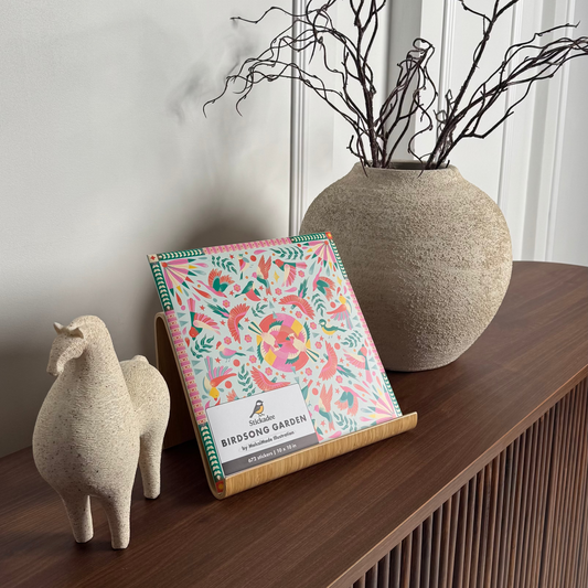 Floral notebook on a wooden surface with decorative elements