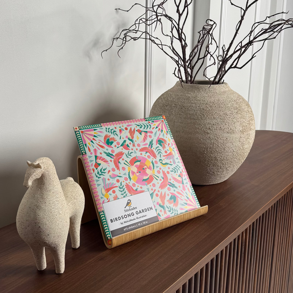 Floral notebook on a wooden surface with decorative elements