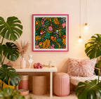 Decorative interior with a colorful framed artwork, plants, and a pink chair.